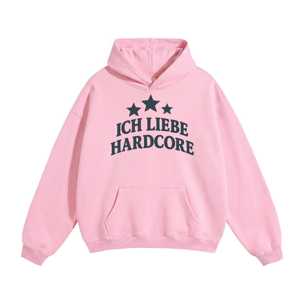 A light pink unisex oversize pullover hoodie with a front kangaroo pocket and a dark navy graphic on the chest featuring three stars and the German text 'ICH LIEBE HARDCORE'.