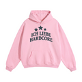 A light pink unisex oversize pullover hoodie with a front kangaroo pocket and a dark navy graphic on the chest featuring three stars and the German text 'ICH LIEBE HARDCORE'.